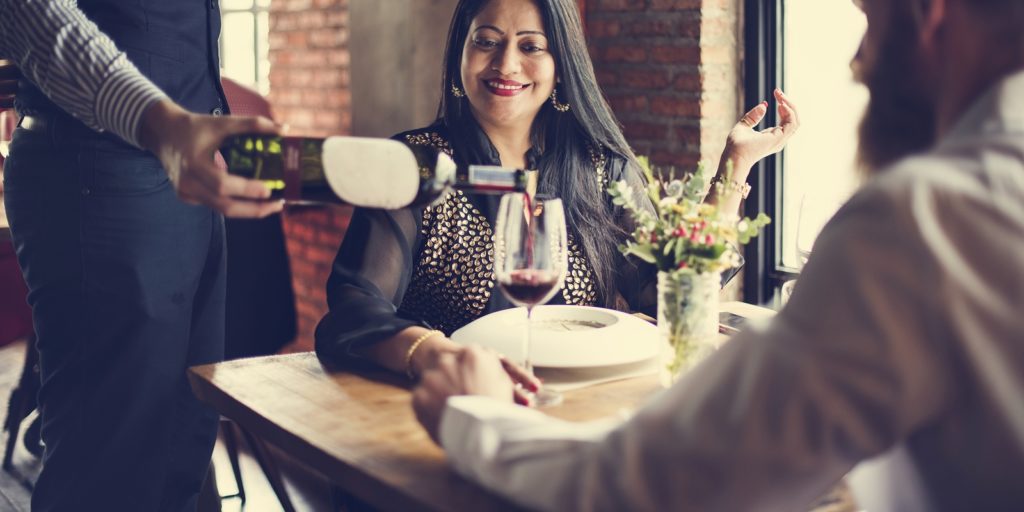 Drinking wine at the restaurant for the first date