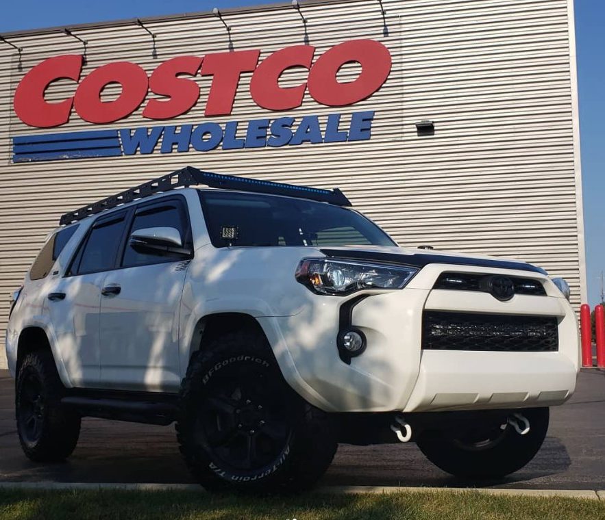 Costco warehouse with white toyota 4runner out front