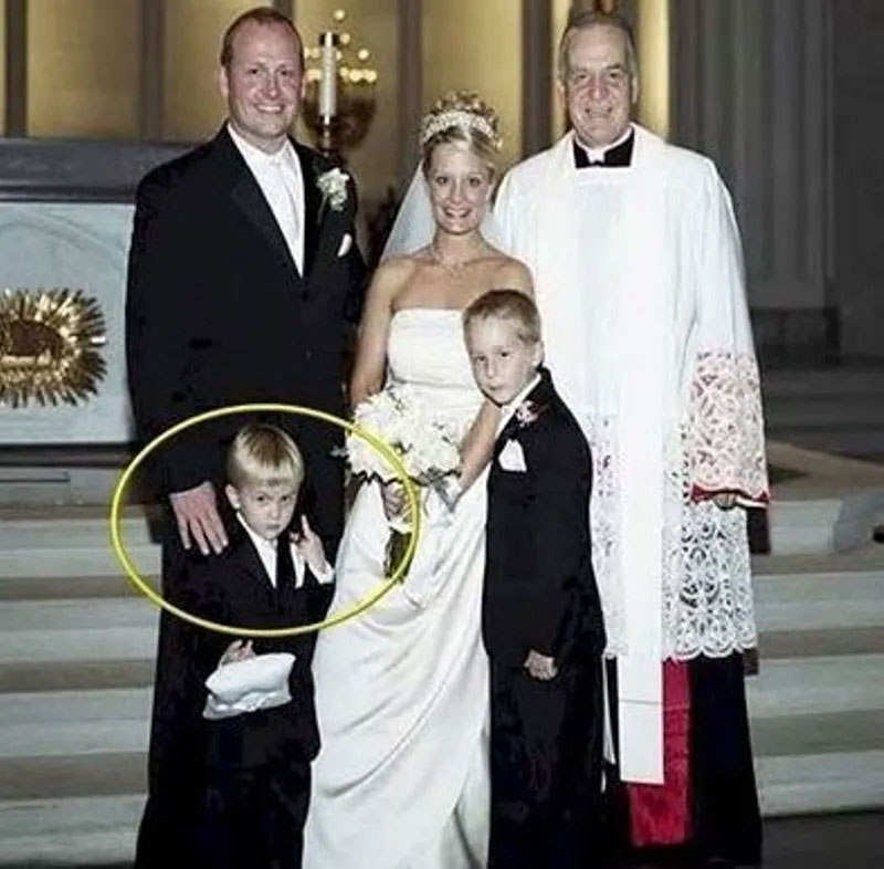 boy holding up middle finger