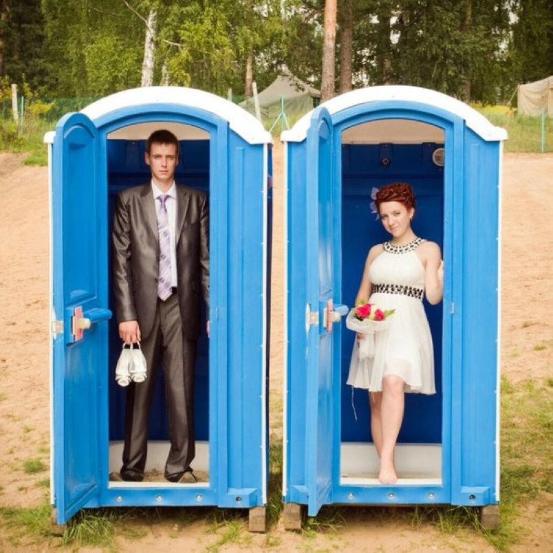 couple in porta-potties