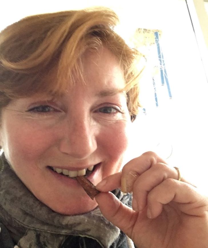 woman eating tree bark